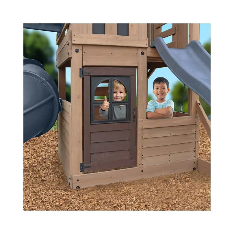 Outdoor playset featuring a Gorilla Skyline Lookout design, complete with slides, climbing structures, and swings for children.