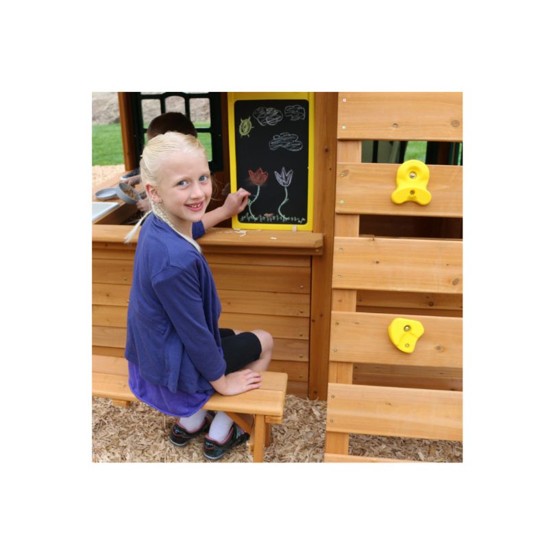 Kidkraft Charleston Lodge Fort – F24935-5 A wooden play fort with multiple levels, slides, and climbing features, designed for children's outdoor play and adventure