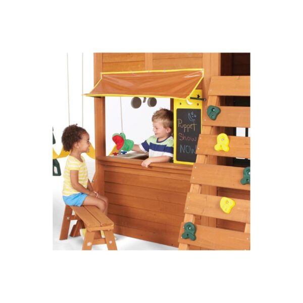 A wooden play fort with multiple levels, slides, and climbing features, designed for children's outdoor play and adventure