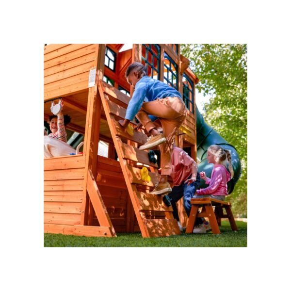 KidKraft Falcon Ridge Swing Set featuring swings, a slide, and climbing features in a backyard setting for children's play