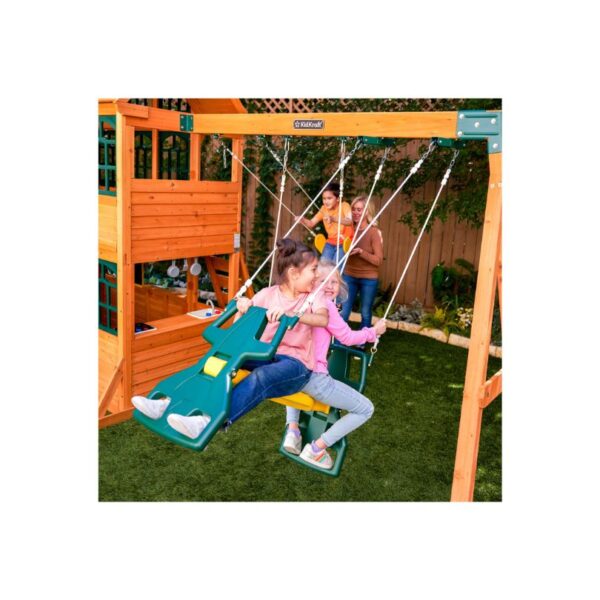 KidKraft Falcon Ridge Swing Set featuring swings, a slide, and climbing features in a backyard setting for children's play