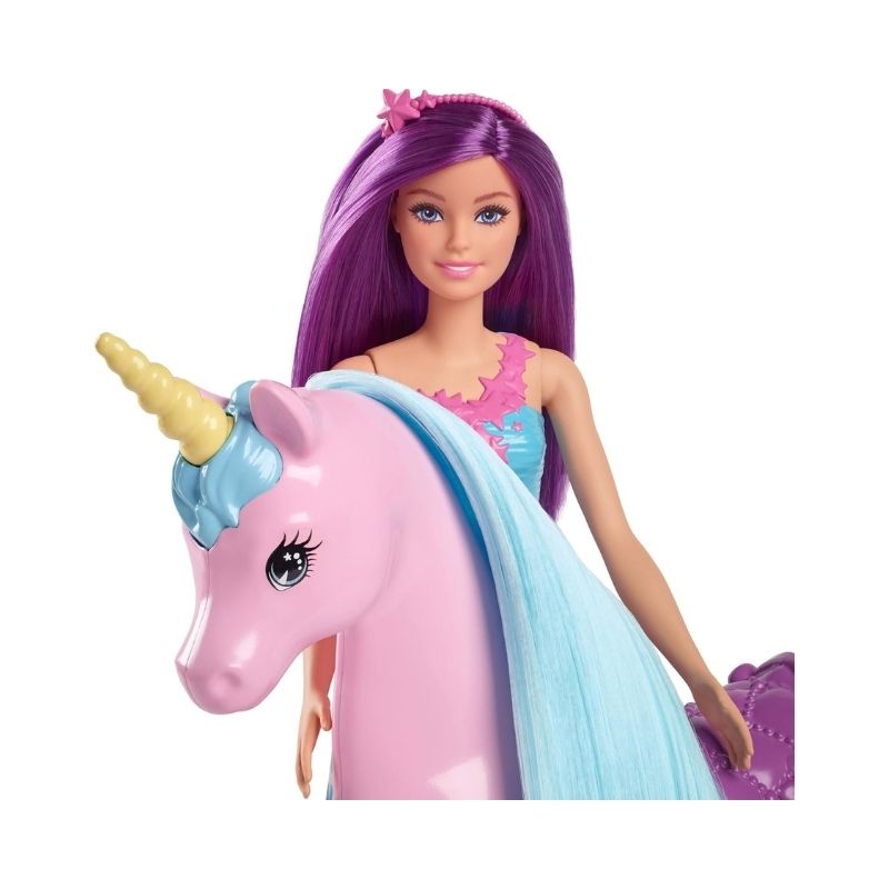 Barbie doll with a unicorn in a colorful fantasy playset, featuring accessories for imaginative play and storytelling