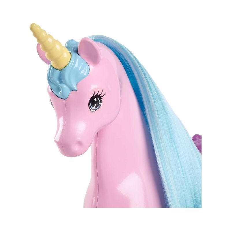 Barbie doll with a unicorn in a colorful fantasy playset, featuring accessories for imaginative play and storytelling