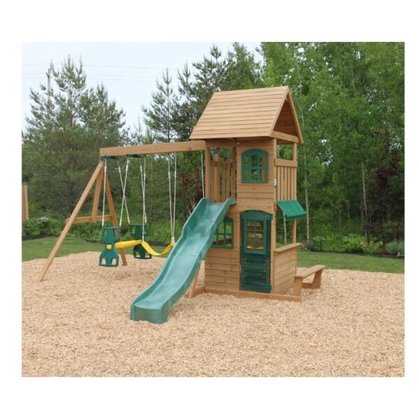 Kidkraft Windale Fort outdoor swing set featuring a wooden fort, swings, and a slide in a backyard setting.