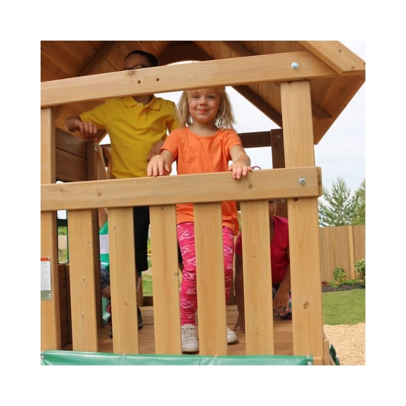 Kidkraft Windale Fort Outdoor Swing Sets – F23220-4 Kidkraft Windale Fort outdoor swing set featuring a wooden fort, swings, and a slide in a backyard setting.