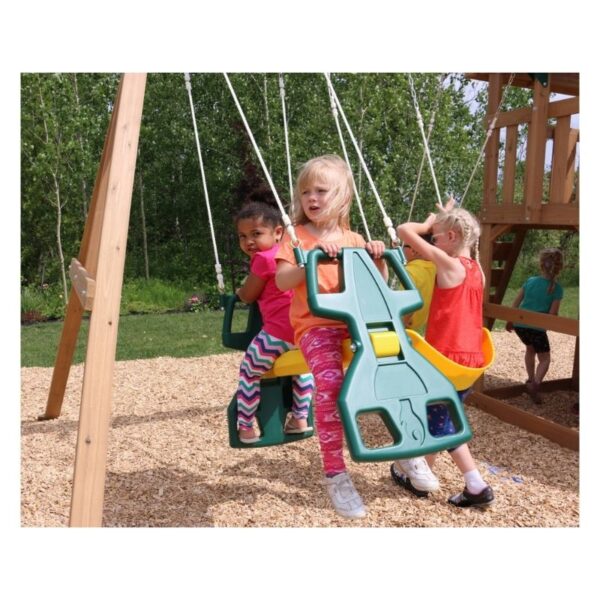 Kidkraft Windale Fort outdoor swing set featuring a wooden fort, swings, and a slide in a backyard setting.