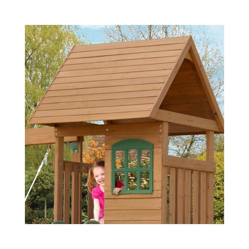 Kidkraft Windale Fort Outdoor Swing Sets – F23220-6 Kidkraft Windale Fort outdoor swing set featuring a wooden fort, swings, and a slide in a backyard setting.