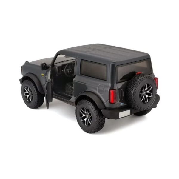 Diecast model of a 2021 Ford Bronco Badlands in gray, showcasing detailed design and realistic features