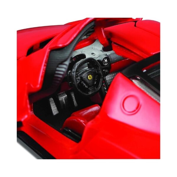Maisto 1:24 scale model of a Ferrari Enzo on an assembly line, showcasing intricate details and vibrant red color