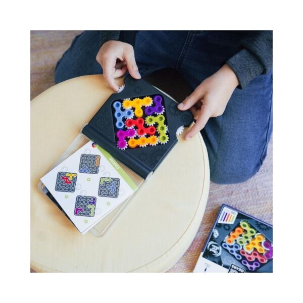 Colorful gears in various sizes interlock to form a brain teaser game designed to enhance problem-solving skills