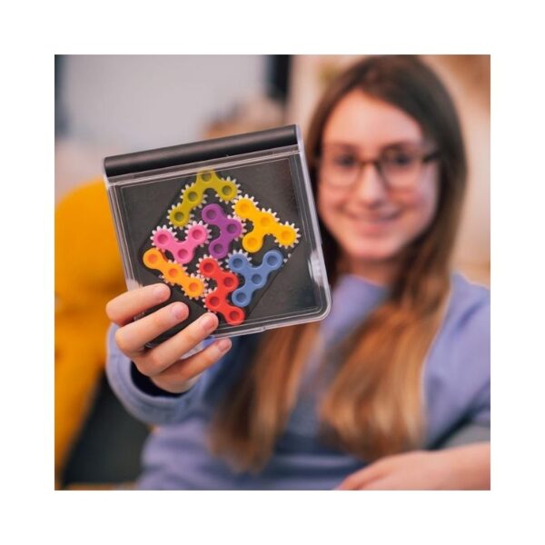 Colorful gears in various sizes interlock to form a brain teaser game designed to enhance problem-solving skills