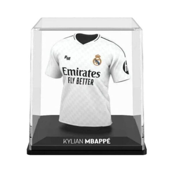 Real Madrid home jersey memorabilia featuring player Kylian Mbappé, showcasing team colors and log