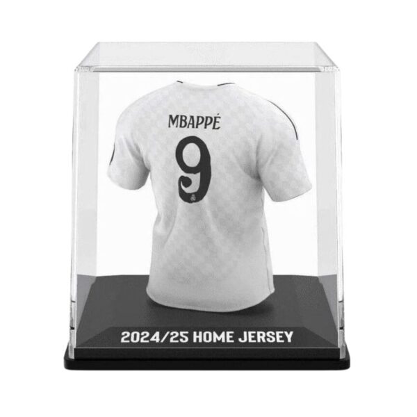 Real Madrid home jersey memorabilia featuring player Kylian Mbappé, showcasing team colors and log