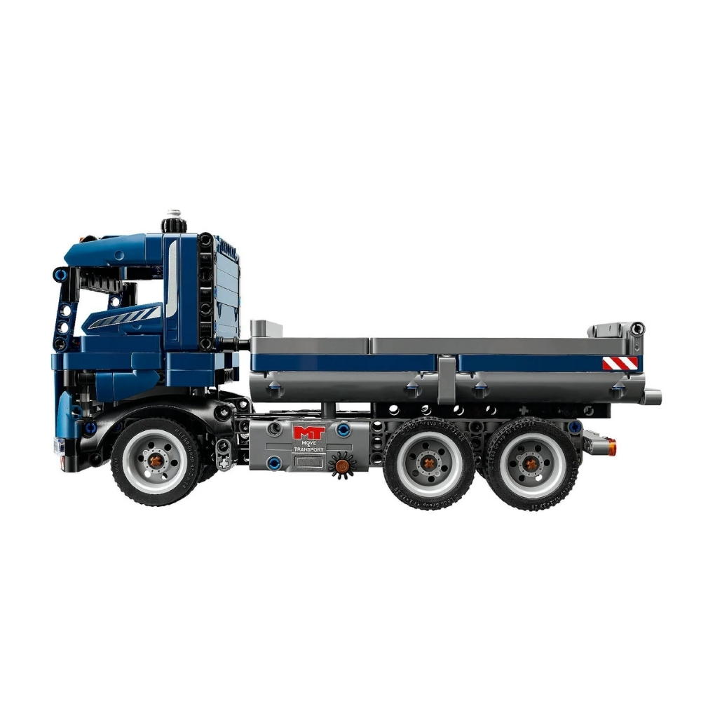 LEGO 42203 Technic Tipping Dump Truck V29 – 6526812-2 LEGO Technic Tipping Dump Truck V29 model showcasing a detailed construction vehicle with a tipping bed and wheels