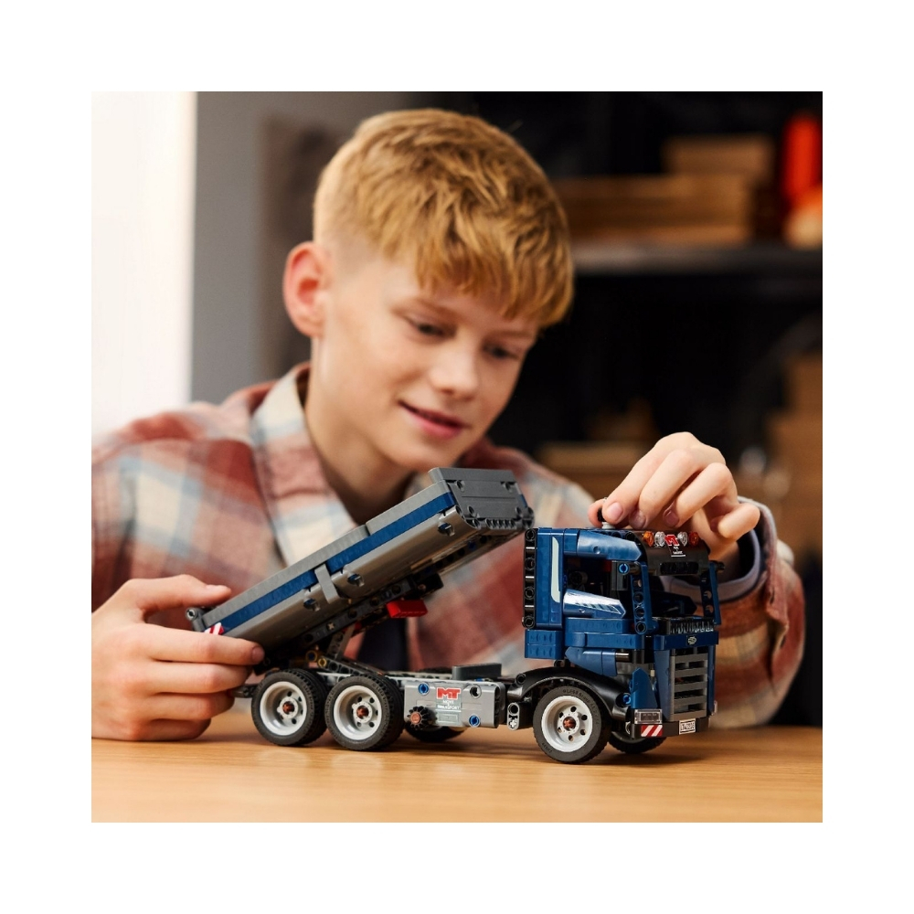 LEGO 42203 Technic Tipping Dump Truck V29 – 6526812-5 LEGO Technic Tipping Dump Truck V29 model showcasing a detailed construction vehicle with a tipping bed and wheels