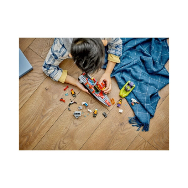 LEGO City 60373 Fire Rescue Boat set featuring a boat, firefighter minifigure, and water rescue accessories