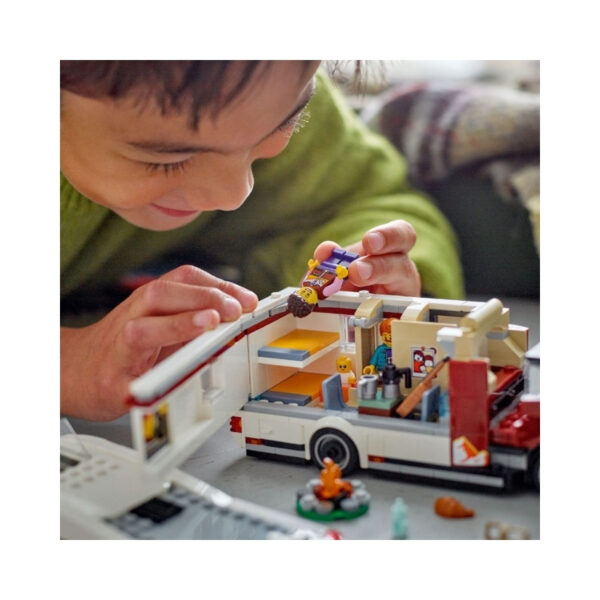 LEGO City 60454 Holiday Adventure Camper Van set featuring a colorful van, outdoor scene, and mini-figures enjoying a trip