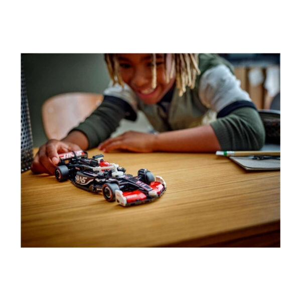 LEGO Speed 77250 set featuring the Haas F1 Team VF-24 race car, showcasing detailed design and vibrant colors