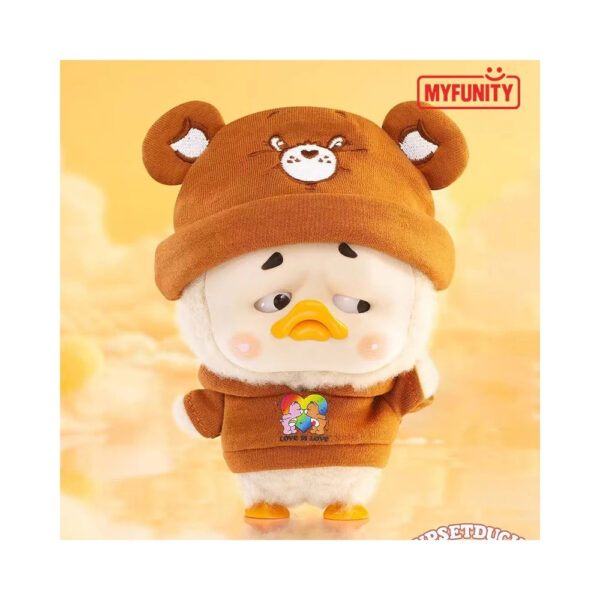 Plush keychain of a rainbow duck from the Care Bears x Upset Duck collaboration, presented in a blindbox packaging