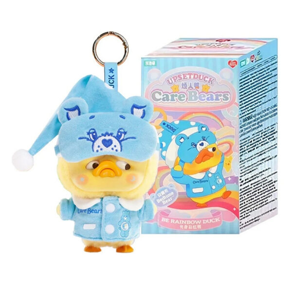 Plush keychain of a rainbow duck from the Care Bears x Upset Duck collaboration, presented in a blindbox packaging