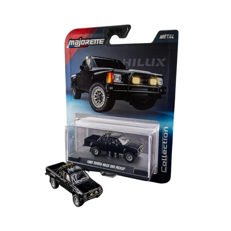 Die-cast model of a 1985 Toyota Hilux SR5 pickup truck in 1:64 scale, displayed in an acrylic case